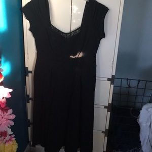 Black dress with a mid flowing bottom.